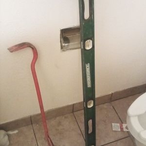 Level and roofing pry bar